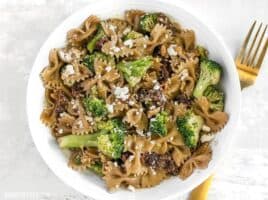 A few pantry staples come together to make a fantastic dinner in this fast, easy, and flavorful one Skillet Pasta with Sun Dried Tomatoes Walnuts and Feta. BudgetBytes.com