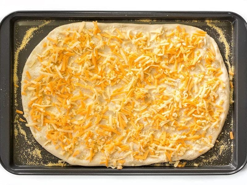 Cover dough with cheese