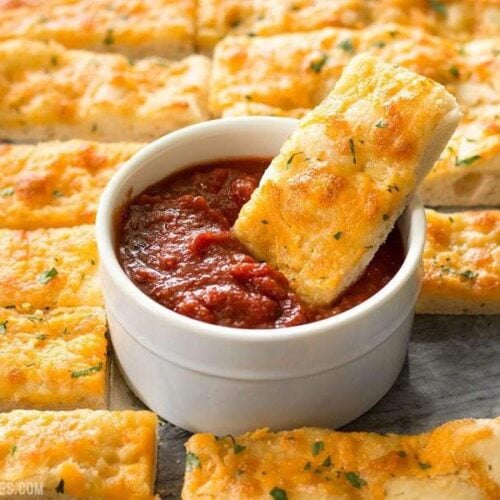 This Homemade Cheesy Garlic Bread is the real deal with homemade dough, fresh garlic, real butter, and your favorite cheese. BudgetBytes.com