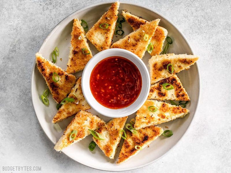 These subtly sweet Coconut Crusted Tofu dippers are the perfect vehicle for tangy sweet chili sauce. Serve as a snack or part of your favorite bowl meal. BudgetBytes.com