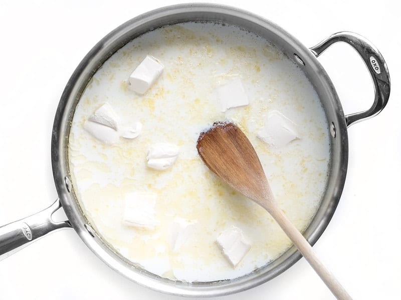 Cream Cheese added to to skillet with butter, garlic, and milk