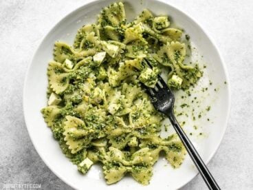 Kale makes a great inexpensive and earthy pesto! Dress up this Kale Pesto pasta with add-ins to make it a meal, or keep it simple for the perfect summer side. BudgetBytes.com