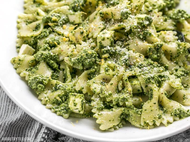 Close up of a bowl full of kale pesto pasta