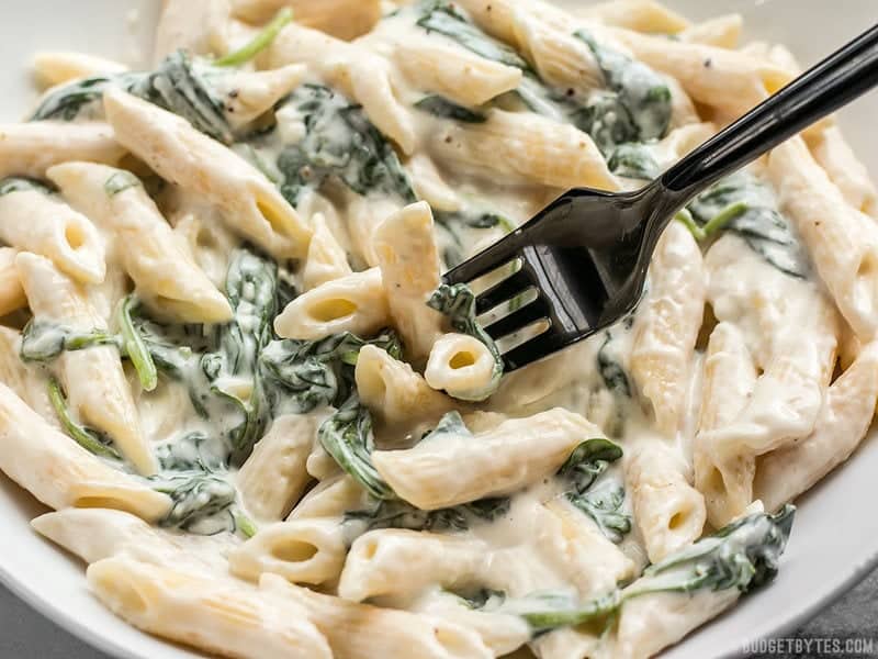 A forkful of super creamy and delicious "lighter" Spinach Alfredo Pasta