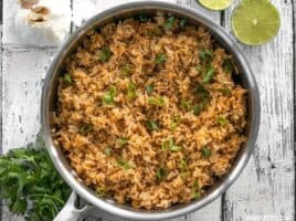 This flavorful Taco Rice is packed full of herbs and spices, but is neutral enough to serve as the base for several different recipes, like bowl meals, burritos, and more! BudgetBytes.com