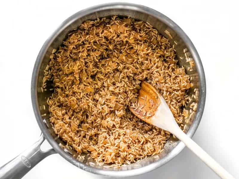 Toast Rice and Spices in the sauce pot