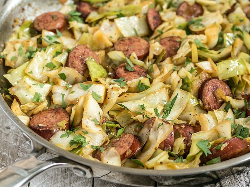 A close up side view of Kielbasa and Cabbage Skillet in the pan. 