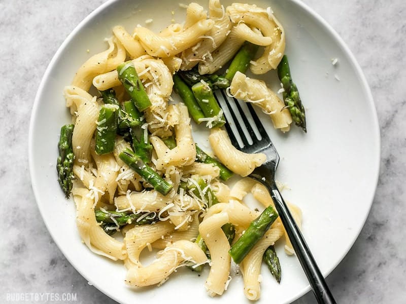 A half eaten bowl of Lemon Garlic Asparagus Pasta 