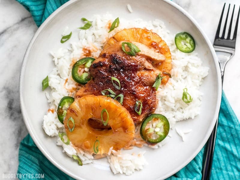 A quick pan sauce drenches tender chicken thighs and thick pineapple slices in this easy Skillet Pineapple BBQ Chicken. BudgetBytes.com