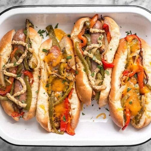 You don't need a grill to make these sweet and tangy Roasted Bratwurst with Peppers and Onions because the oven does all the work. BudgetBytes.com