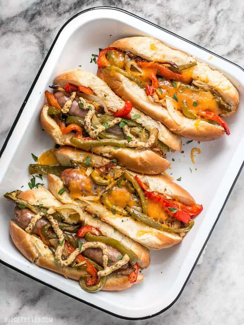 You don't need a grill to make these sweet and tangy Roasted Bratwurst with Peppers and Onions because the oven does all the work. BudgetBytes.com