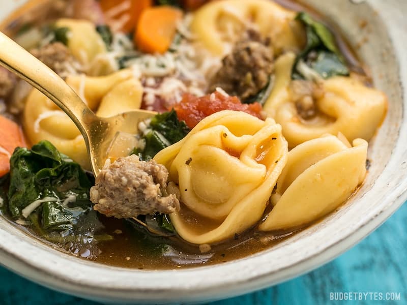 Close up of a bowl of Sausage and Tortelloni soup 