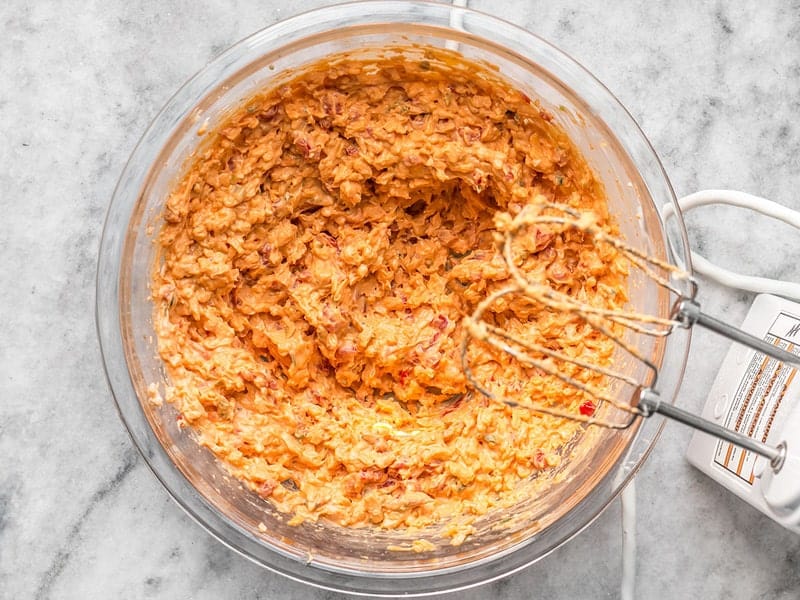 Sriracha Pimento Cheese Spread mixed with hand mixer