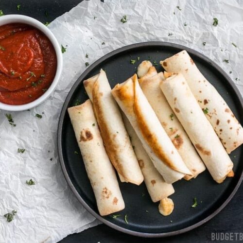 Forget frozen pizza rolls! These Pizza Roll Ups are the perfect last minute appetizer or indulgent snack on busy days! BudgetBytes.com