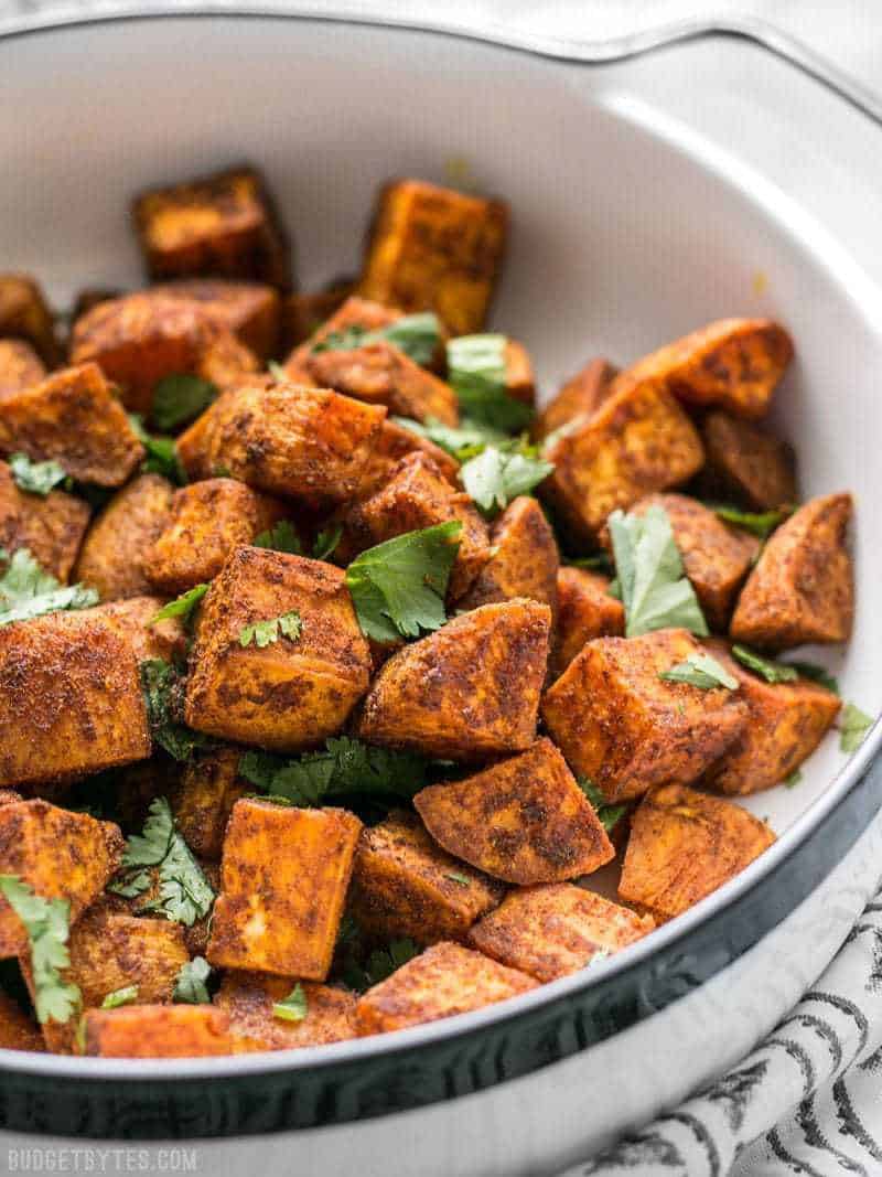 Close up of Moroccan Spiced Sweet Potatoes in dish with cilantro