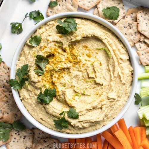 This Coconut Curry Hummus throws a new twist on the traditional dip with creamy coconut milk, vibrant lime, and warm curry spices. BudgetBytes.com