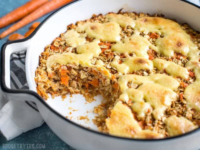 Carrot Cake Baked Oatmeal in casserole dish with some missing