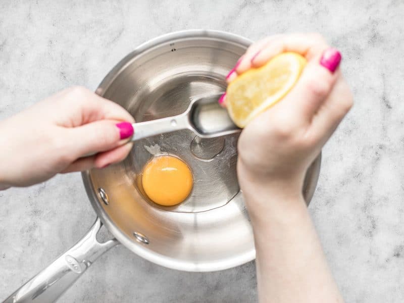 Combine Egg Yolk, Water, and Lemon Juice in a pot