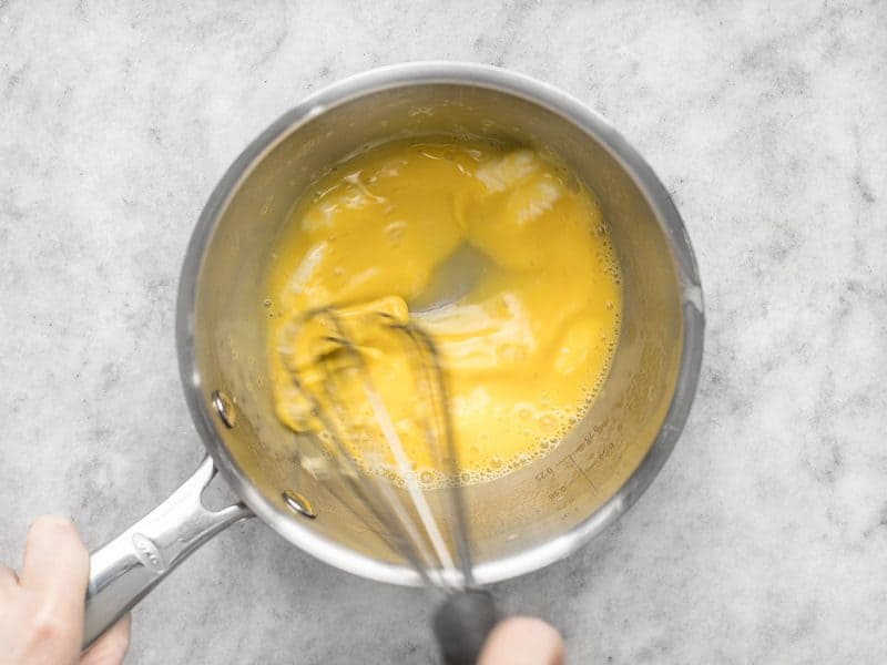 Slowly Melt and Whisk Butter Into Yolk