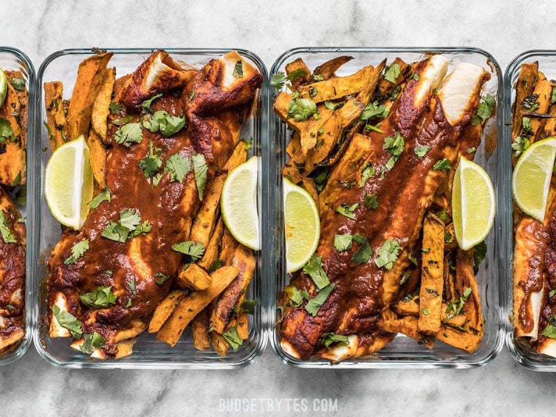 Black Bean and Avocado Enchilada Meal Prep containers in a row