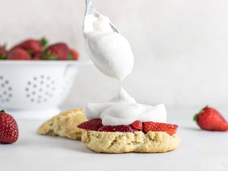 Layer Whipped Cream onto Strawberry Shortcake