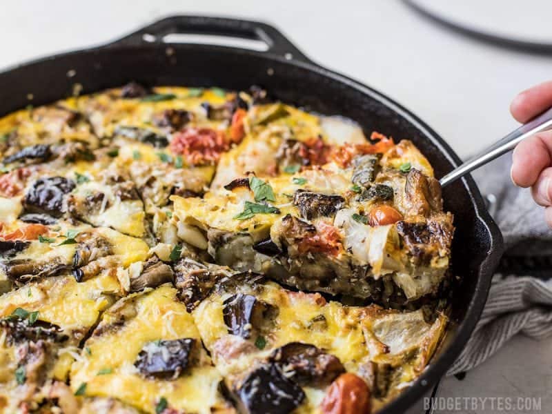 One slice of the Ratatouille Frittata being lifted out of the skillet