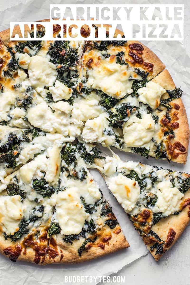 Garlicky greens and creamy ricotta pair perfectly on this light and fresh Garlicky Kale and Ricotta Pizza. It’s the perfect pizza for summer! BudgetBytes.com