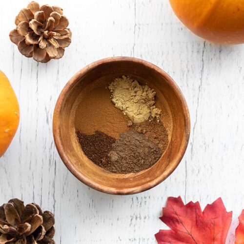 Overhead view of a small wooden bowl with spices