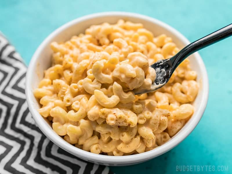 Close up of a forkful of rich and creamy Rice Cooker Mac and Cheese