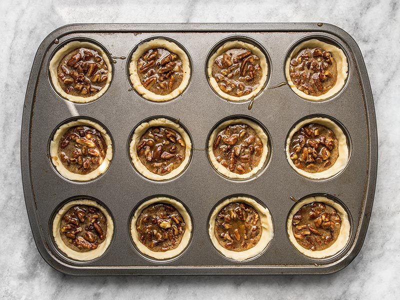 Mini Dark Chocolate Pecan Pies ready to bake