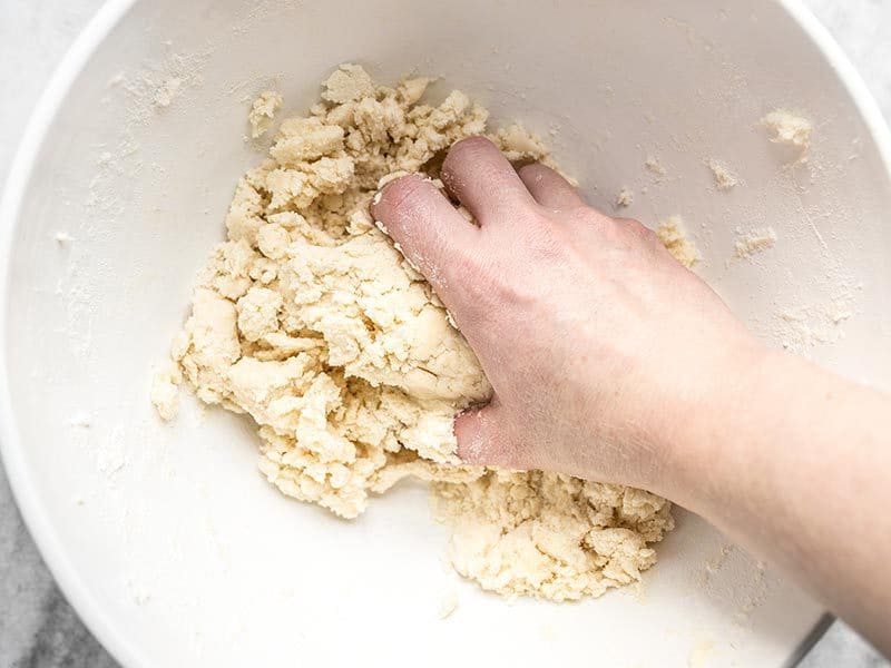 Use Hands to Form Pecan Pie Dough