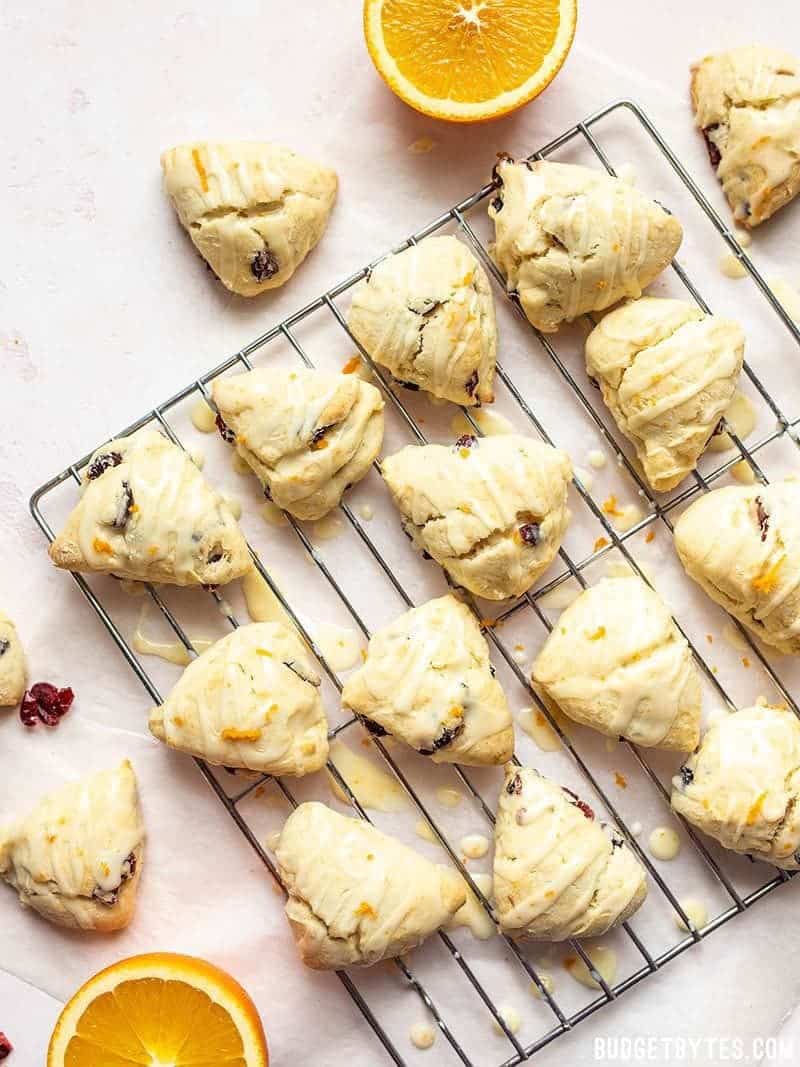 Glazed Cranberry Orange Cream Scones on a cooling rack.