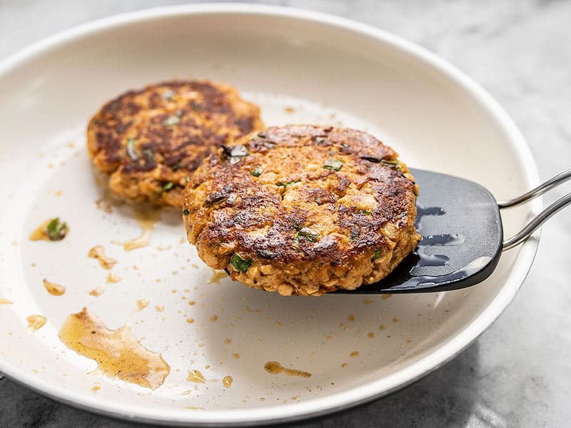 Cooked Salmon Burgers in skillet