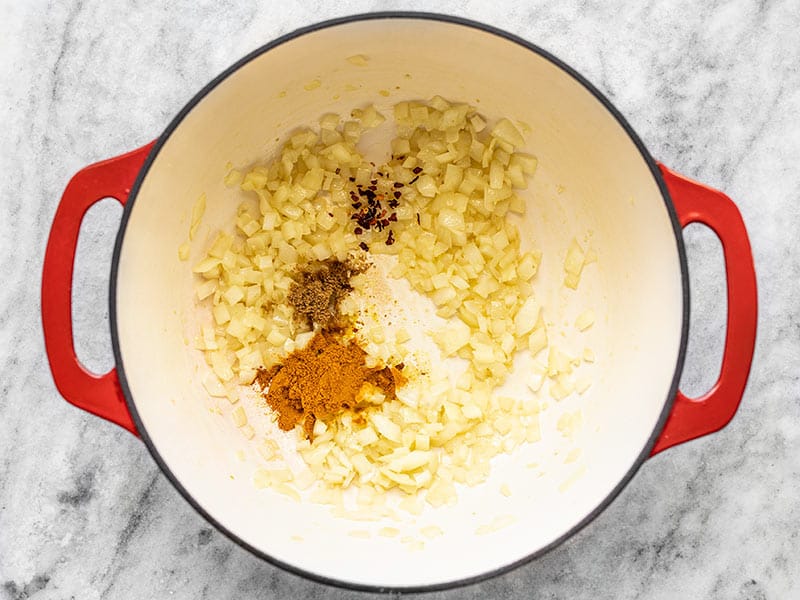 Sautéed Onion, Garlic, and Ginger in the pot with turmeric, cumin, and red pepper