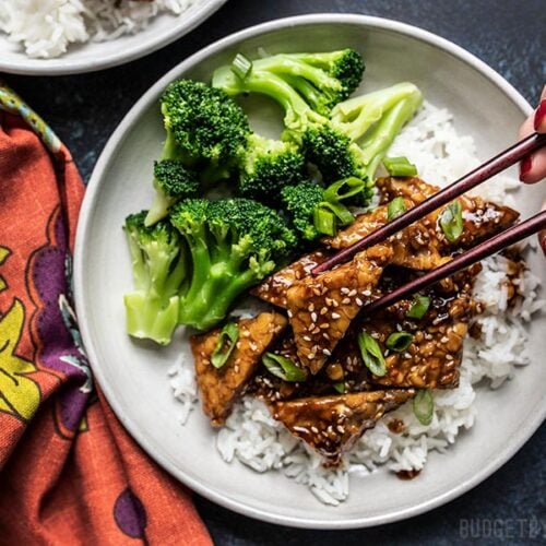 Sesame Tempeh Bowls being eaten with chopsticks