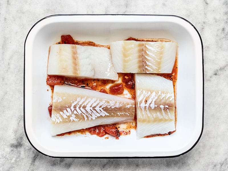 Add Thawed Fish to Baking Dish on top of tomatoes