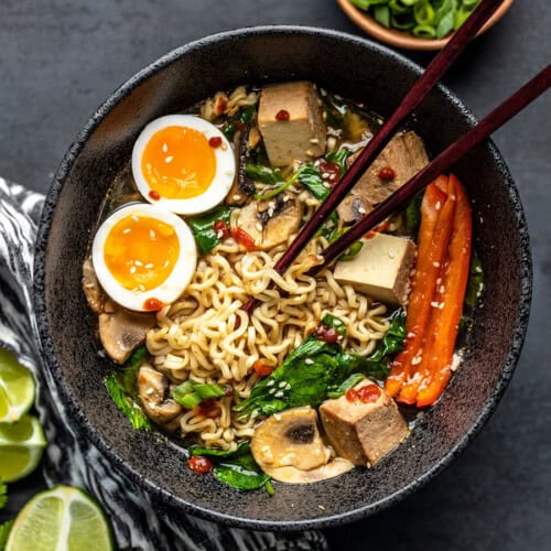 Overhead view of the finished bowl of upgraded instant ramen with chopsticks in the center.