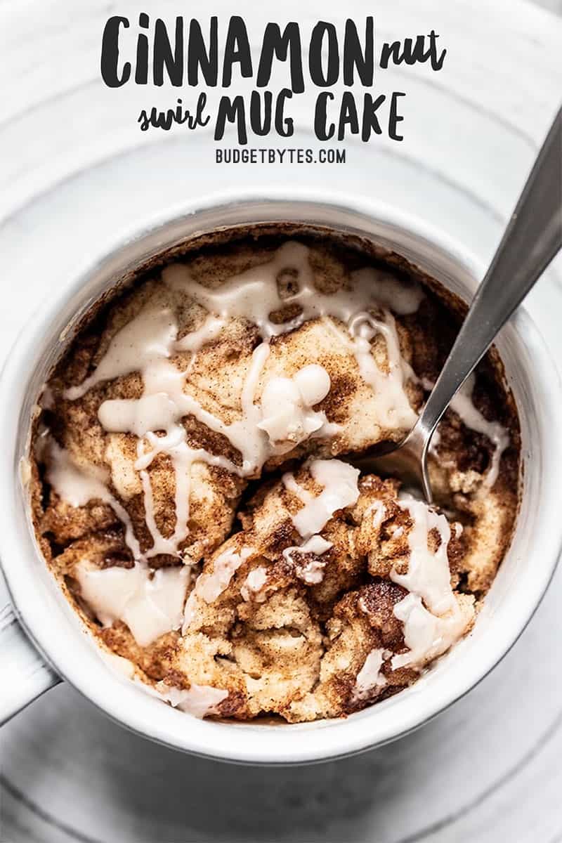 Close up overhead shot of a spoon digging into a Cinnamon Nut Swirl Mug Cake