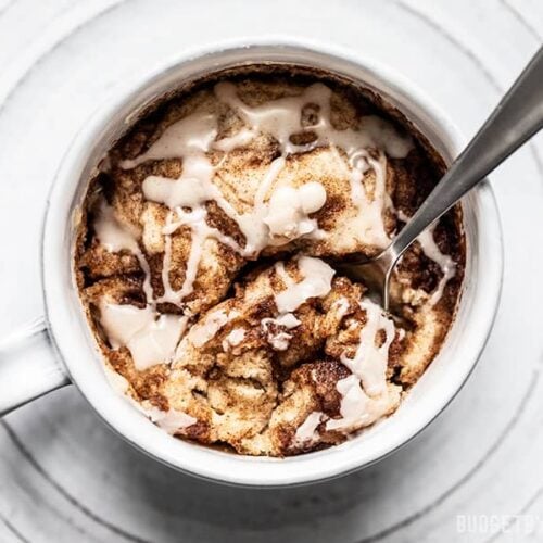 Overhead view of a spoon dug into a Cinnamon Nut Swirl Mug Cake