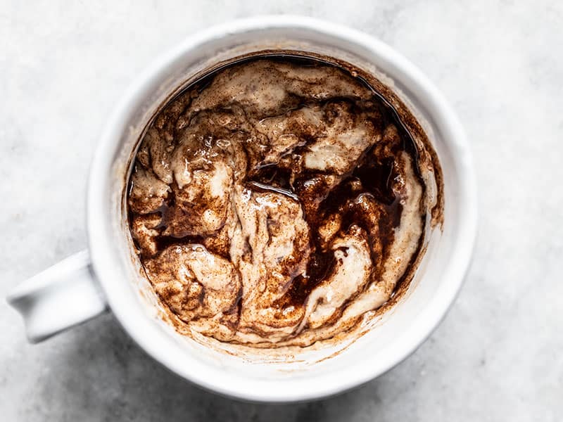 Cinnamon butter swirled into mug cake batter