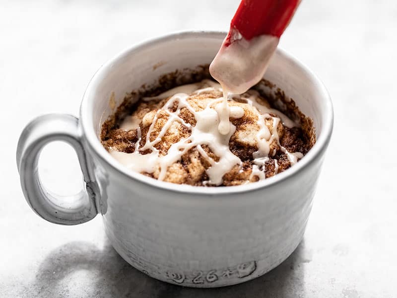 Drizzle Icing over the finished mug cake