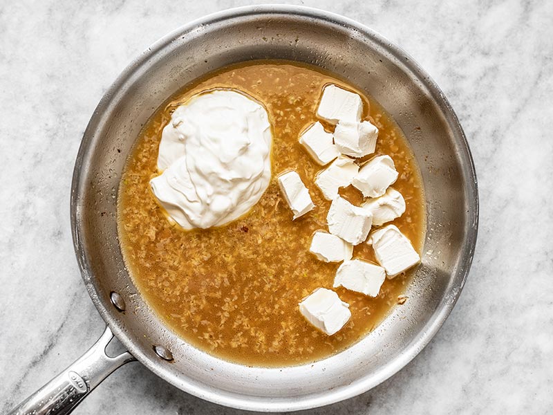 Sour Cream and Cream Cheese in the skillet with chicken broth