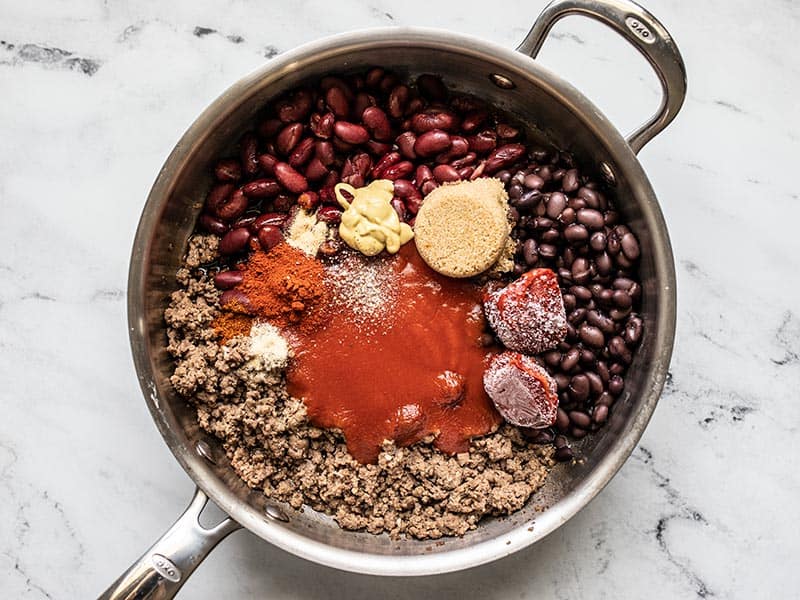 BBQ Sauce Ingredients in the skillet with the beef and beans.