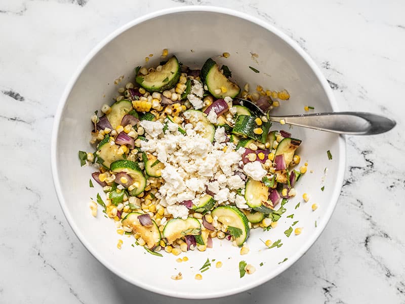 Add crumbled feta to salad