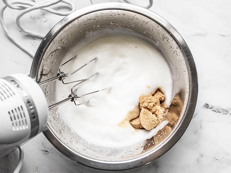 Brown sugar and vanilla extract added to whipped aquafaba.