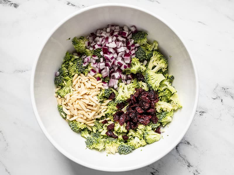 Broccoli salad ingredients in the bowl, not stirred.