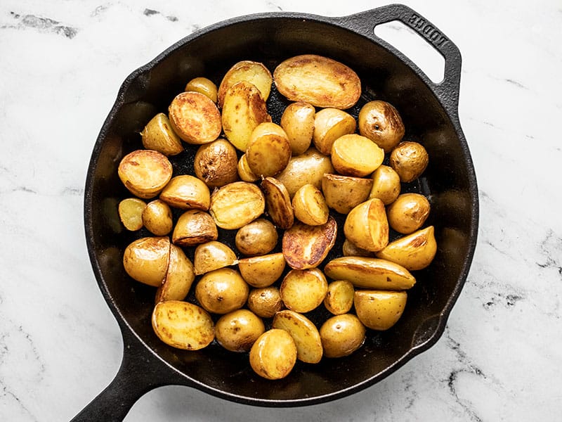 Crispy fried potatoes in a cast iron skillet