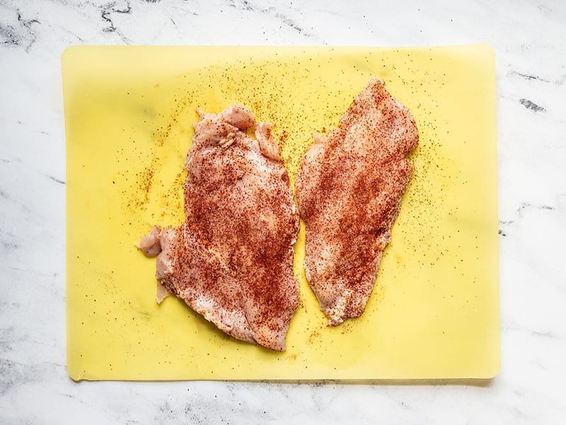 Pounded chicken breasts seasoned with chili powder