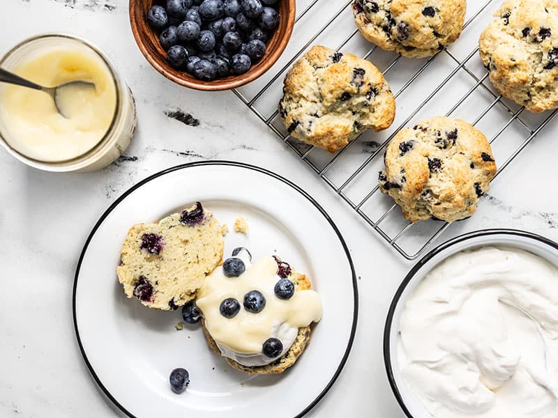 lemon curd and fresh blueberries added to biscuit