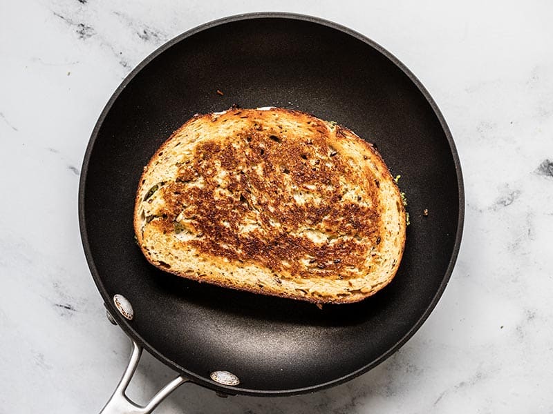 Cooked Pesto Grilled Cheese in the skillet